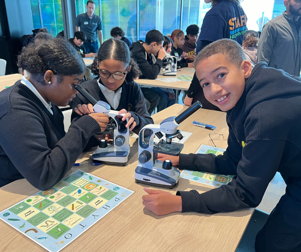 kid looking through microscope