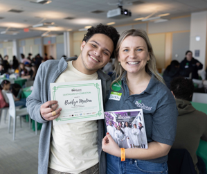 BioQuest student and mentor smiling with yearbook